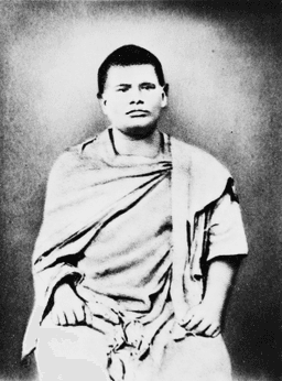 Seated, cropped at knees