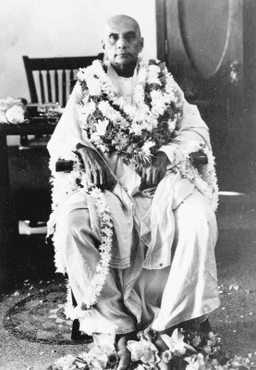 Seated, garlanded