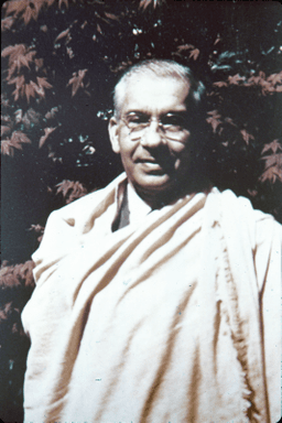 Unknown Swami in chadder and western garb, medium shot portrait