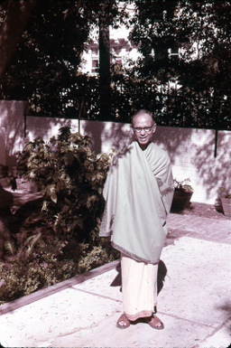 Swami Swananda stands outside the Berkeley Center in the garden
