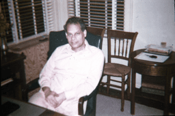Swami Swahananda seated in green chair in the Berkeley Center office
