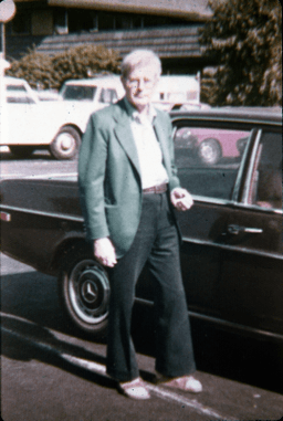 unknown man with car in parking lot of Berkeley Center