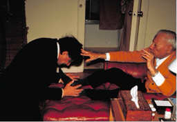 Swami Aseshananda takes dust of Swami Prabhavanada's Feet